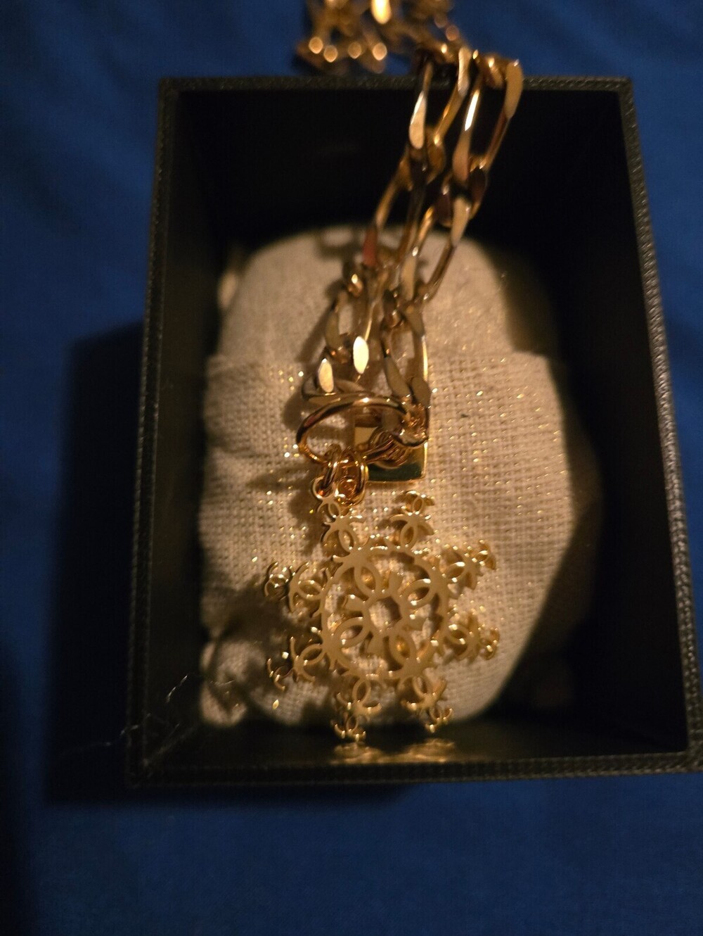 Gold Tone Snowflake Pendant Necklace with Figaro Chain
